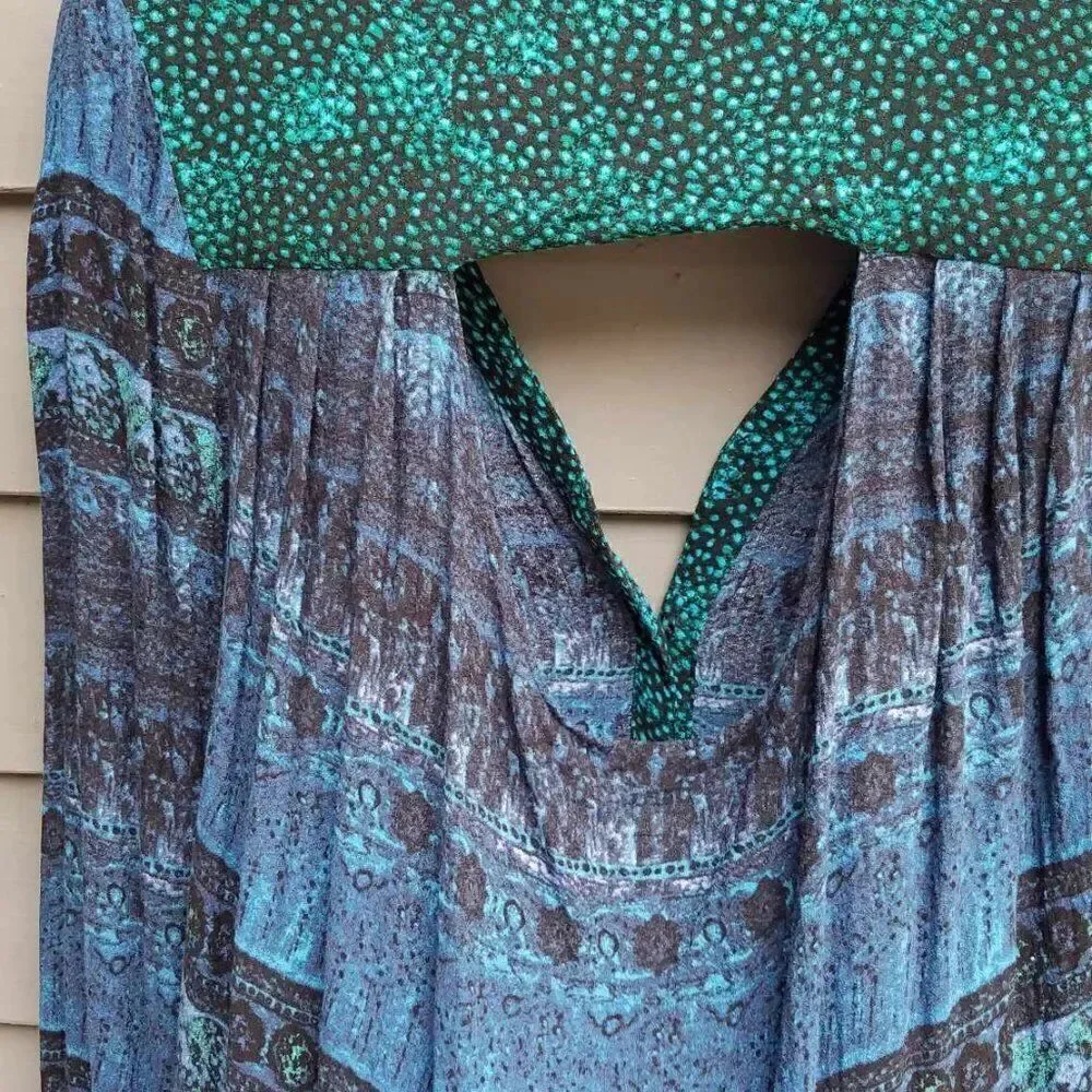 BKE Black Blue Green Top with a cut out in the back size Medium